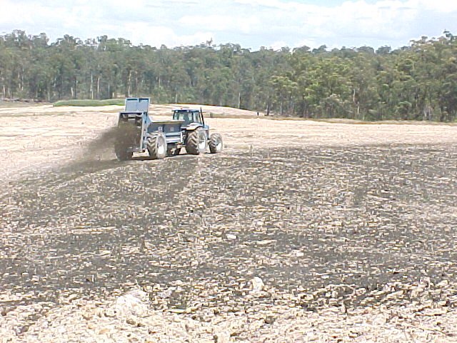 Biosolids spreading operation on an open-cut coal mine rehabilitation site